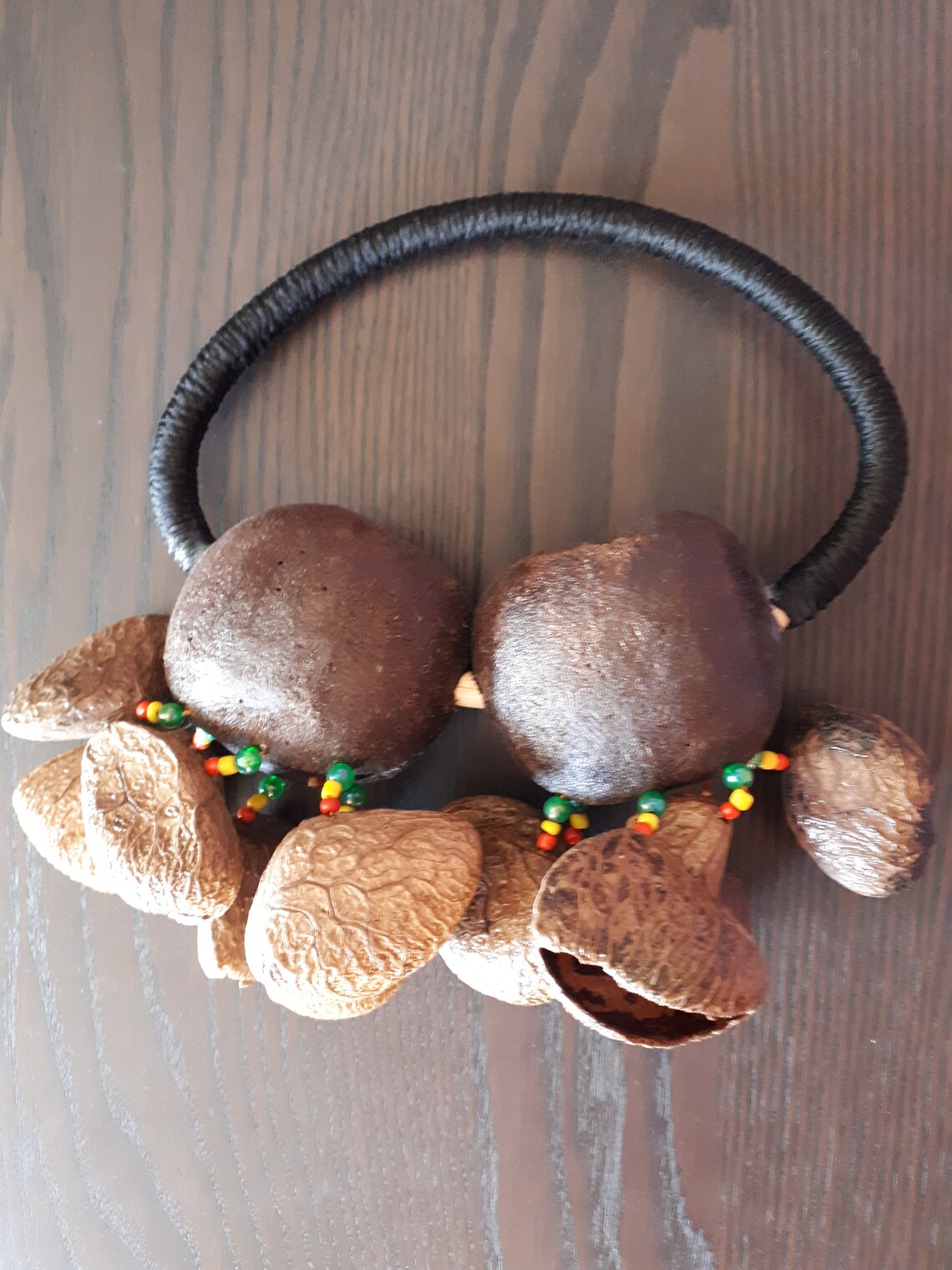 A Handheld shaker made of Tree Nut Shells. Percussion shaker. Etsy