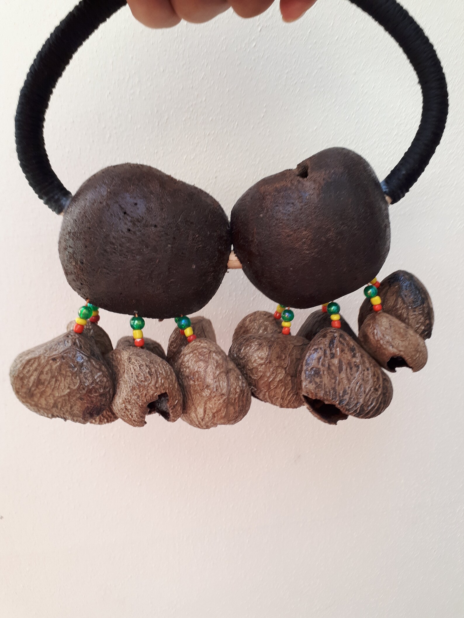 A Handheld shaker made of Tree Nut Shells. Percussion shaker. Etsy