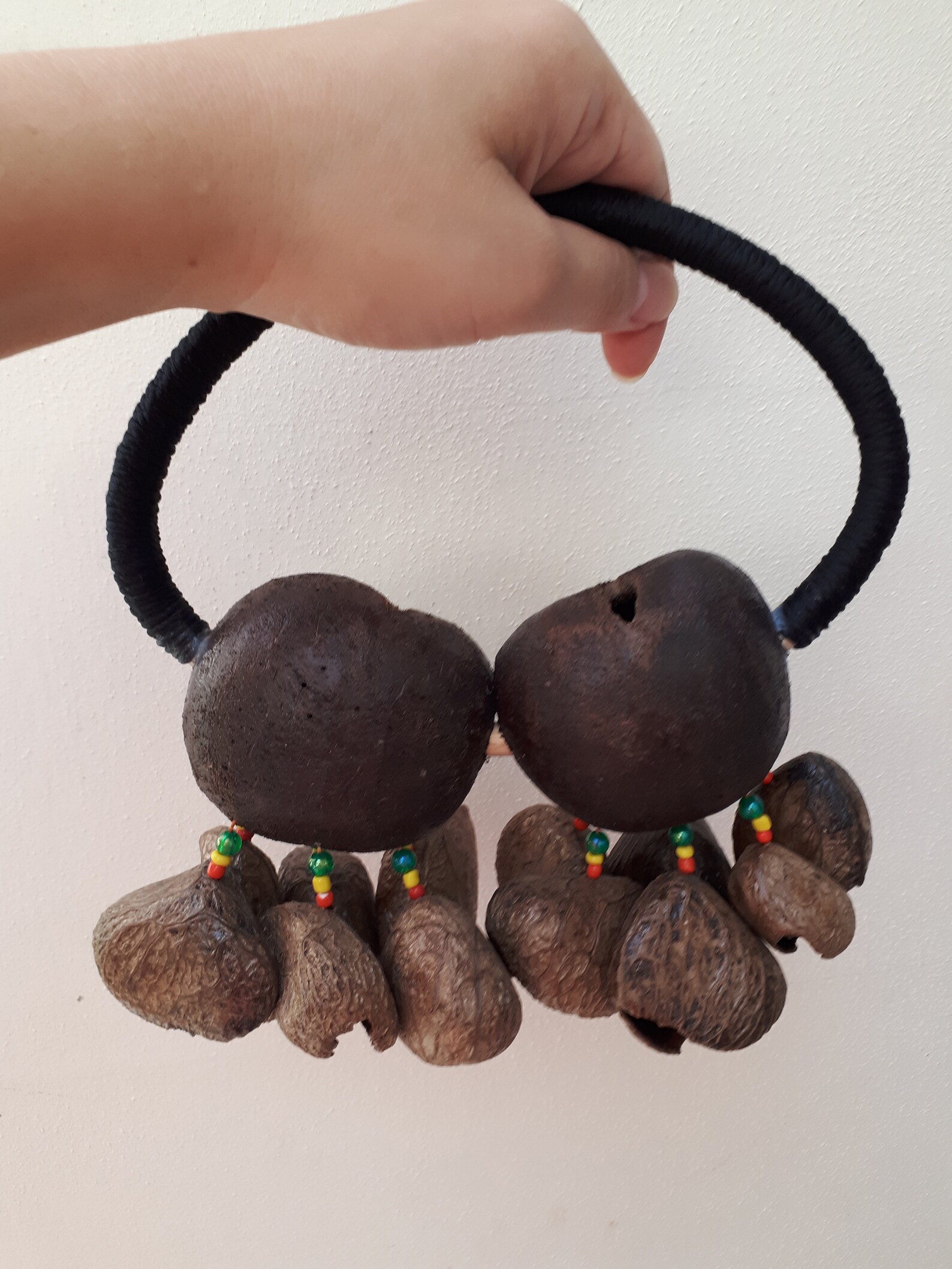 A Handheld shaker made of Tree Nut Shells. Percussion shaker. Etsy