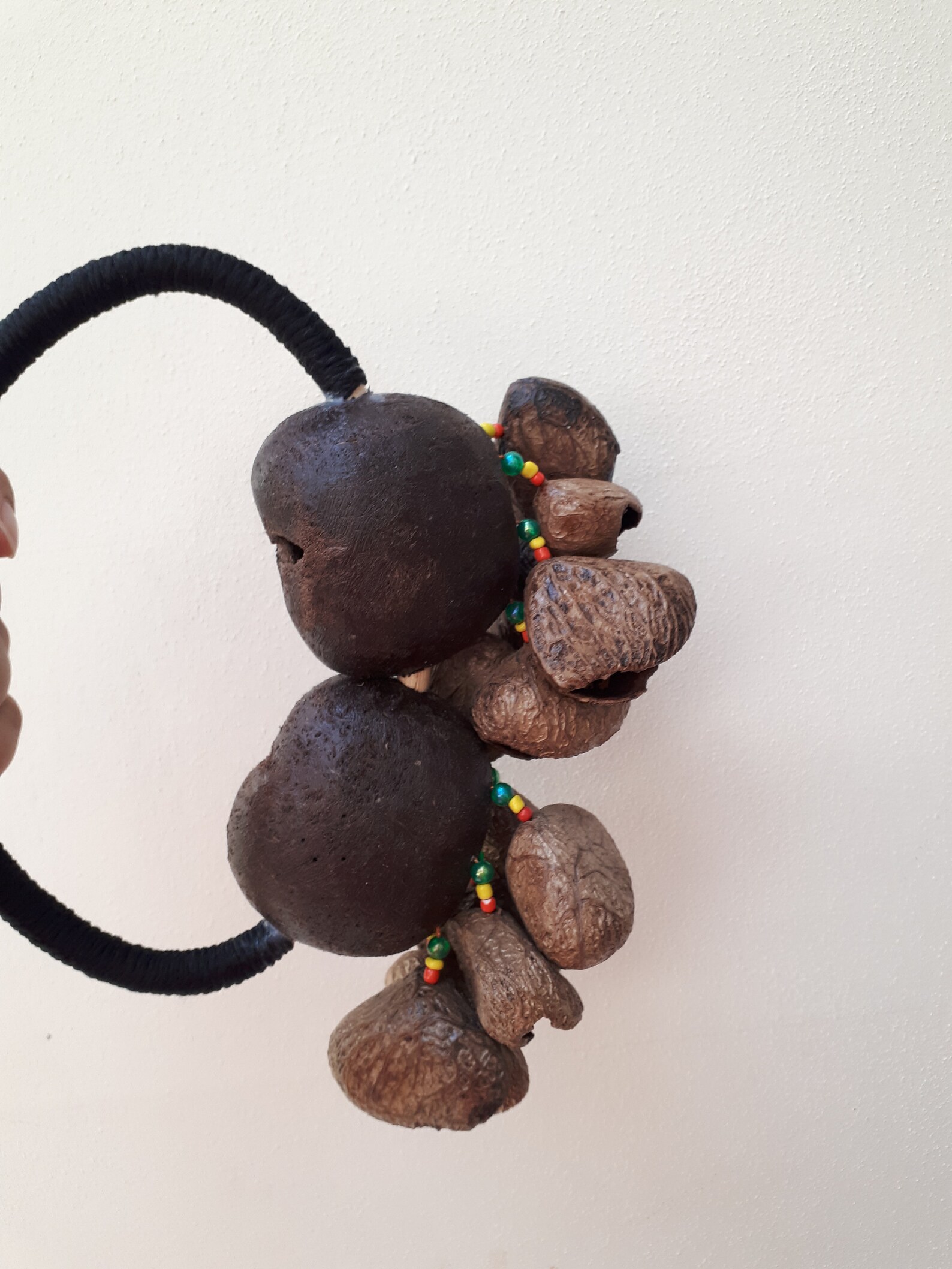 A Handheld shaker made of Tree Nut Shells. Percussion shaker. Etsy