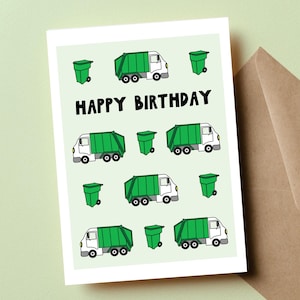 May include: A birthday card with a light green background features illustrations of green garbage trucks and green trash cans. The words "HAPPY BIRTHDAY" are written in black block letters.