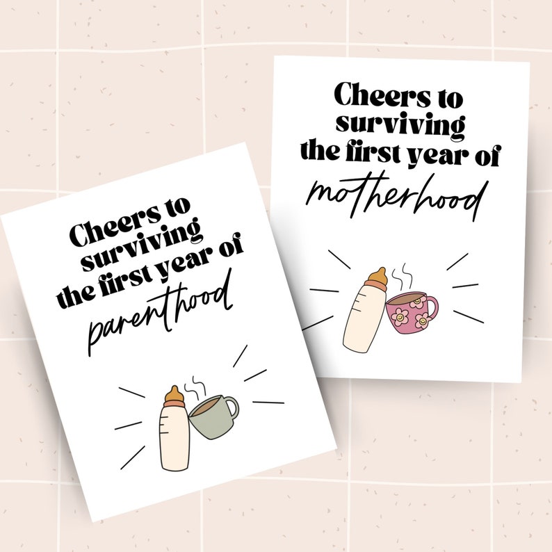 May include: Two white cards with black text and illustrations. The text on the top card reads "Cheers to surviving the first year of motherhood". The text on the bottom card reads "Cheers to surviving the first year of parenthood". Both cards feature a cartoon illustration of a baby bottle and a coffee cup.