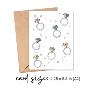 May include: A white card with the text "You're getting married!" surrounded by colorful diamond rings. The card is 4.25 x 5.5 inches.