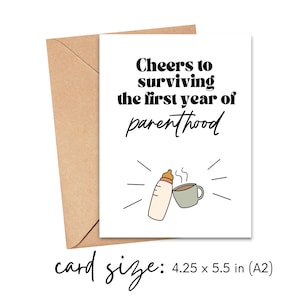 May include: A white card with black text that reads "Cheers to surviving the first year of parenthood". The card has a simple illustration of a baby bottle and a cup of coffee. The card size is 4.25 x 5.5 inches.