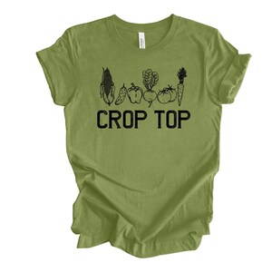 May include: A green t-shirt with a black graphic of vegetables and the text "Crop Top".