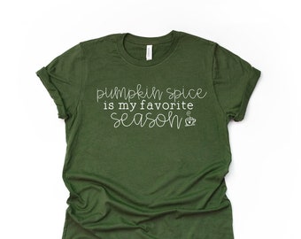 May include: Green t-shirt with white text that reads "pumpkin spice is my favorite season" with a small coffee cup icon.