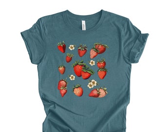May include: A teal blue t-shirt with a graphic print of red strawberries and white flowers.