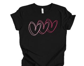 May include: Black t-shirt with a pink and white graphic of three overlapping hearts.