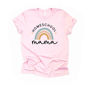 May include: Pink t-shirt with a rainbow and the text "HOMESCHOOL mama" in black.