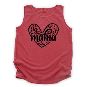 May include: Red sleeveless tank top with a black heart design featuring a leopard print pattern and the word "mama" inside the heart.
