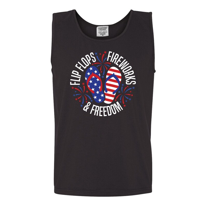 May include: Black tank top with a white graphic of red, white, and blue flip flops with stars and fireworks. The text reads "Flip Flops & Fireworks & Freedom".