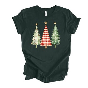 May include: A dark green t-shirt with a design of three Christmas trees. The trees are decorated with red and white plaid, green and white plaid, and green with white stars.