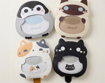 May include: Four character-shaped pouches with clear display windows. Top left is a gray and white penguin. Top right is a cream and brown cat. Bottom left is a white, orange, and gray calico cat. Bottom right is a solid black cat. Each features the text LOFNPIN.