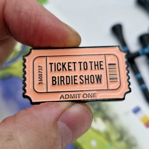 Golf Ball Marker "Ticket To The Birdie Show". Customise with your name on reverse. Metal with enamel infill.