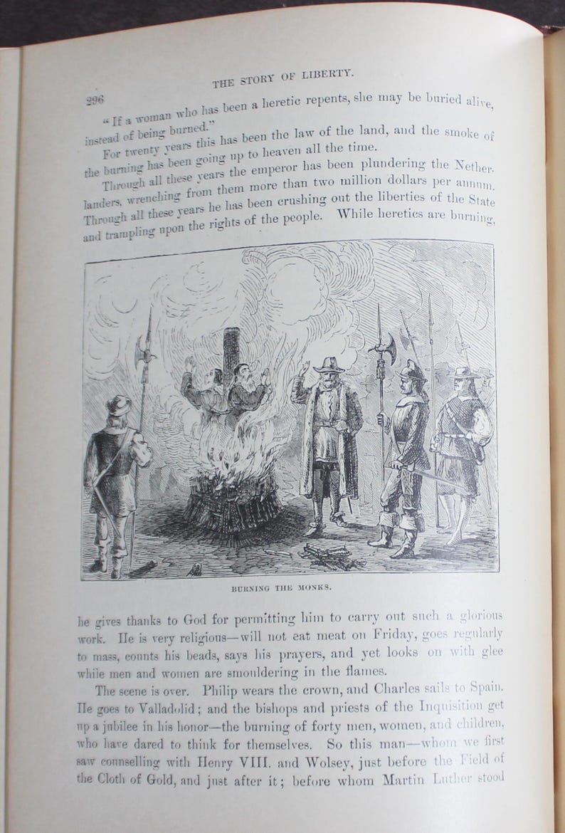 May include: A historical illustration from a book shows the burning of monks. The black and white image features figures in period dress, flames, and text describing the event. The title "Burning the Monks" is at the bottom of the image.