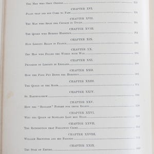 May include: A book's contents page, featuring chapter titles and page numbers. Titles include "The Man Who Split the Church in Twain" and "Why the Queen of Scotland Lost Her Head." The page is aged.