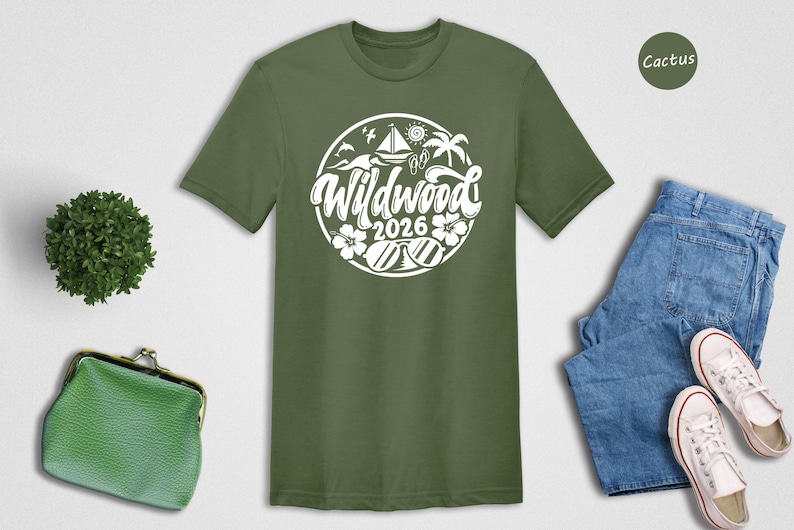a green t-shirt with a white graphic design, a pair of blue jeans, a pair of white sneakers, a green purse, and a small green plant.