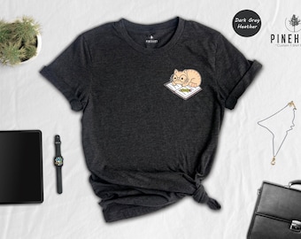 Cat And Book Lover Shirt, Sleeping Cat On Book Pocket Print, Cute Reading Cat Tee, Gift For Cat Moms And Bookworms, Unisex T-Shirt
