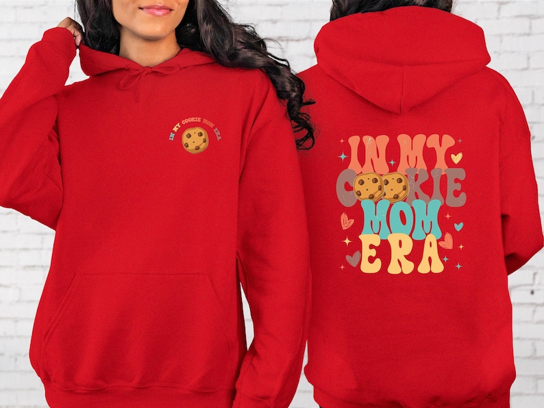 a woman wearing a red hoodie with a cookie on it