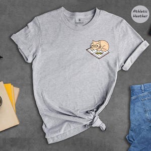 Cat And Book Lover Shirt, Sleeping Cat On Book Pocket Print, Cute Reading Cat Tee, Gift For Cat Moms And Bookworms, Unisex T-Shirt image 7