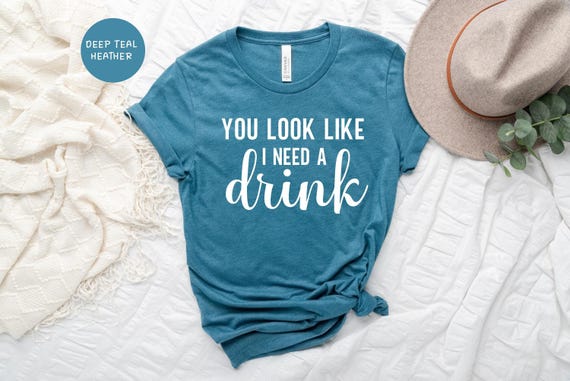 You Look Like Funny Quote Shirt: 'I Need a Drink' Design, Witty Party Tee | Cotton Blend, Eco Friendly, Unisex Sizes S-XXL