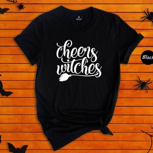 Cheers Witches Shirt, Funny Halloween Tee, Witch Broom Graphic T-Shirt, Girls Night Halloween Party Top, Gift for Her image 1