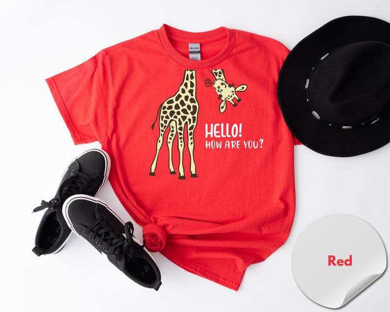 a red t-shirt with a giraffe graphic and the text "Hello! How are you?" along with a pair of black sneakers and a black hat.