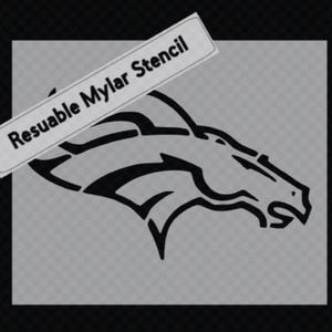 May include: A black stencil featuring a horse head logo, set against a gray background. The stencil is labeled "Resuable Mylar Stencil" in black text on a white rectangular label. The design is suitable for various crafting projects.