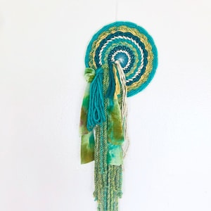 Medusa 8-Inch Round Woven Wall Hanging with Waterfall Fringe