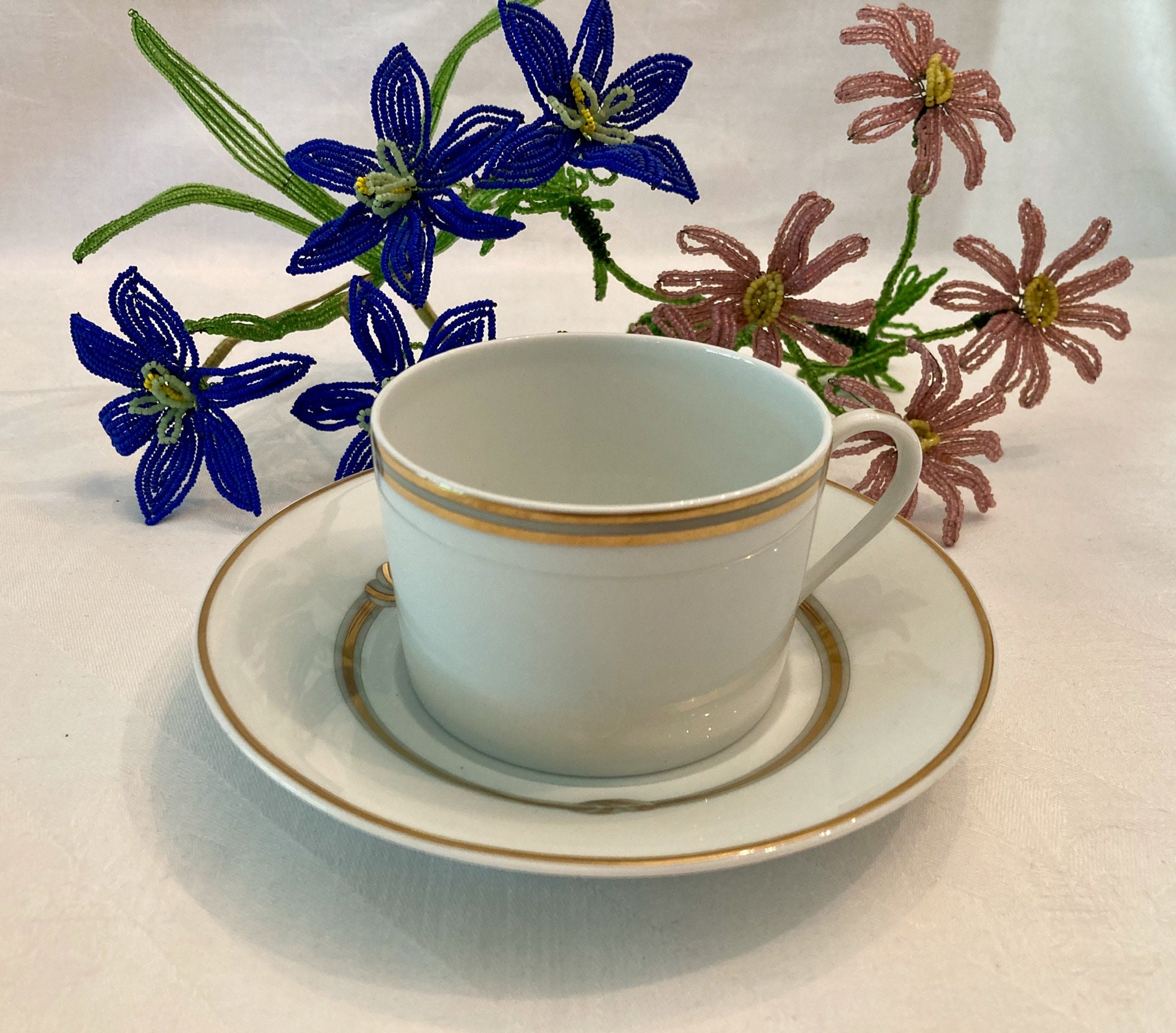 Christofle Ruban or China Tea Cup and Saucer Set: Gold Ribbon