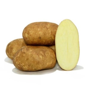 May include: A group of brown potatoes, one cut in half to reveal the pale yellow flesh. The potatoes are oval-shaped with a rough, textured skin. The cut potato shows a smooth, creamy interior.