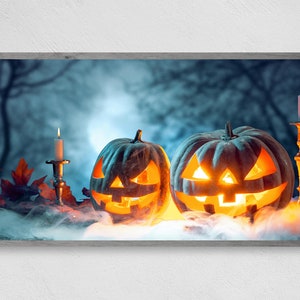 May include: Two carved jack-o'-lantern pumpkins with lit candles inside, set against a dark, foggy forest background. The pumpkins have a spooky, grinning expression.