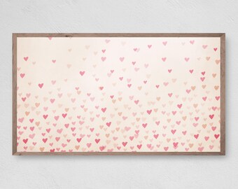 May include: A framed print with a white background and a gradient of pink hearts.
