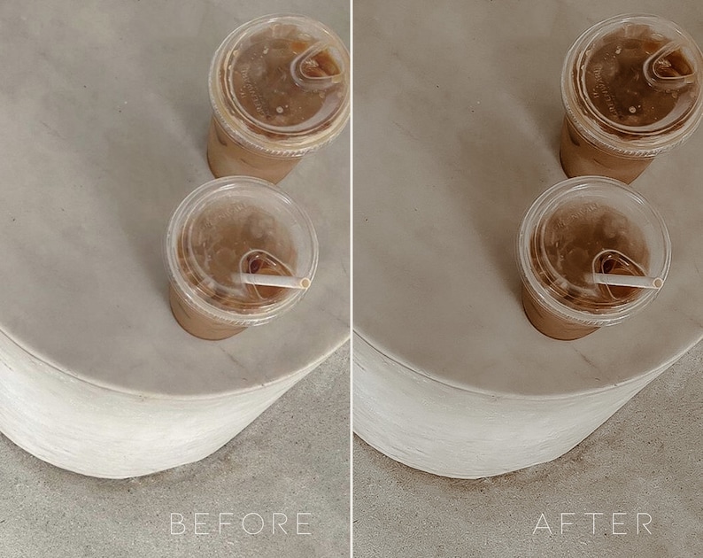 May include: Two iced coffee drinks in clear plastic cups with lids and straws on a white marble surface.
