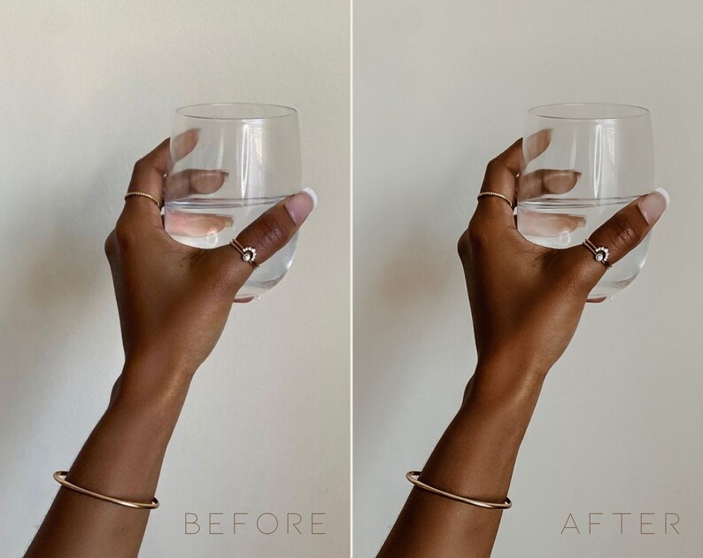 May include: A hand holding a clear glass of water with a gold bangle bracelet on the wrist. The hand is wearing a gold ring with a small diamond on the index finger.