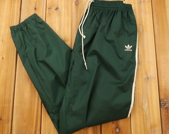 navy blue and lime green adidas pants