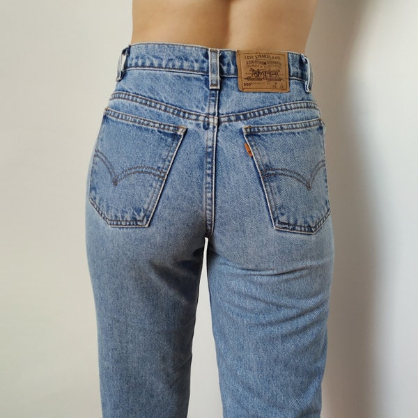 Vintage Levis 550 w27 light wash 90s tapered leg