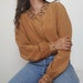 see more listings in the Blouse / Shirt / Top section