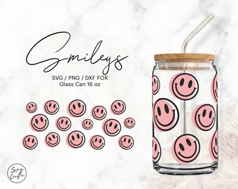May include: A glass can with a wooden lid and a pink smiley face design. The can is 16 ounces and comes with a straw. The text "Smileys" is written in black cursive above the can. The text "SVG/PNG/DXF for Glass Can 16 oz" is written in black below the can.