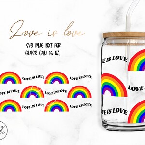 May include: A clear glass tumbler with a wooden lid and a rainbow design. The tumbler has the text "Love is Love" repeated around the side. The tumbler is 16 ounces.