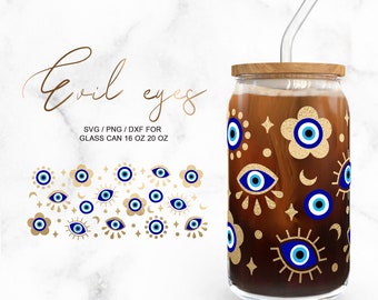 May include: A glass can with a wooden lid and a straw, decorated with blue and gold evil eye designs. The can is 16 or 20 ounces and is perfect for cold beverages.  The design includes a variety of evil eye shapes and patterns, including crescent moons, stars, and flowers.