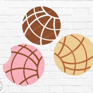 May include: Three colorful, round, pastry-like objects with a grid pattern. The objects are brown, pink, and yellow.