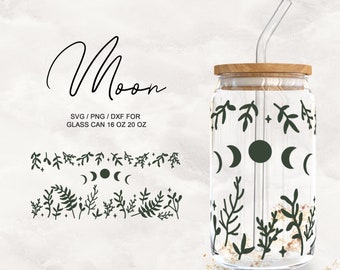 May include: A glass can with a wooden lid and a straw. The can has a design of moons and branches in shades of green. The text "Moon" is written in cursive above the can. The text "SVG/PNG/DXF for Glass Can 16 oz 20 oz" is written below the can.