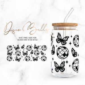 May include: A clear glass tumbler with a wooden lid and a straw. The tumbler is decorated with a pattern of black disco balls and butterflies. The text "Disco Balls" is written in cursive at the top of the image. The text "SVG/PNG/DXF for Glass Can 16 oz 20 oz." is written below the image of the tumbler.