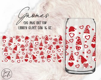 May include: A pattern of red gnomes with white hats and white beards holding red hearts, and red hearts on a white background. The pattern is on a clear glass can with the text "Gnomes SVG PNG DXF for LIBBEY GLASS CAN 16 oz."