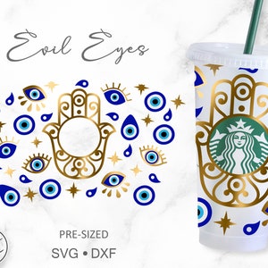 May include: A white reusable cup with a gold hamsa hand design and blue evil eye charms. The cup has a straw and the text "Evil Eyes" is written at the top of the image.