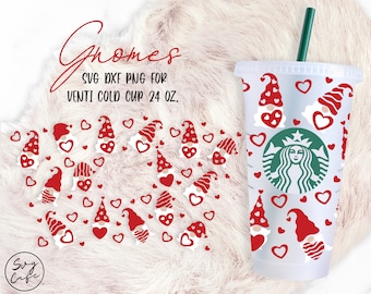 May include: A clear plastic cup with a red and white gnome pattern and hearts. The cup is 24 oz. and has a green Starbucks logo. The text "Gnomes SVG DXF PNG for Venti Cold Cup 24 oz." is at the top of the image.