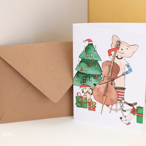 Weihnachtskarte - Die Dackelkatze spielt Cello