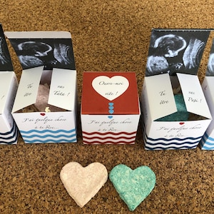 Original pregnancy announcement for the family: a surprise box with ultrasound inside and a heart to sow