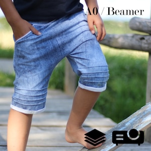 May include: Blue denim shorts with white trim and pleated details. The shorts have pockets and are knee-length. The text "AO / Beamer" is visible in the upper right corner.